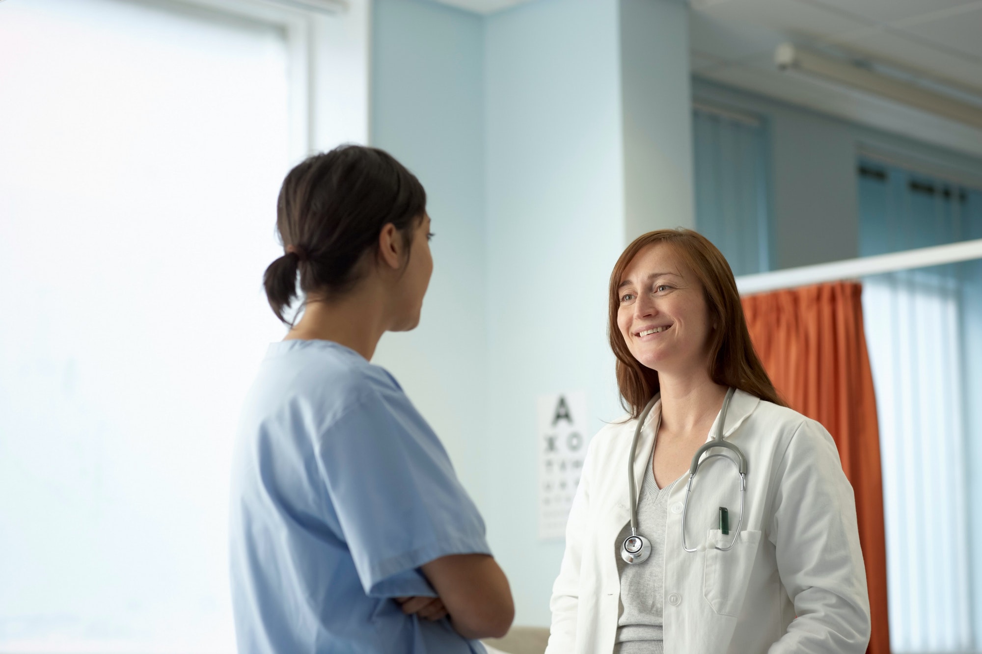 Nurse and doctor in discussion